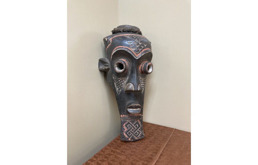 Kete of the Kuba confederation: initiation mask wooden with kaolin white and tukala red pigment. 20 1/4" tall x 9" wide (ear to ear). Dem Rep of Congo