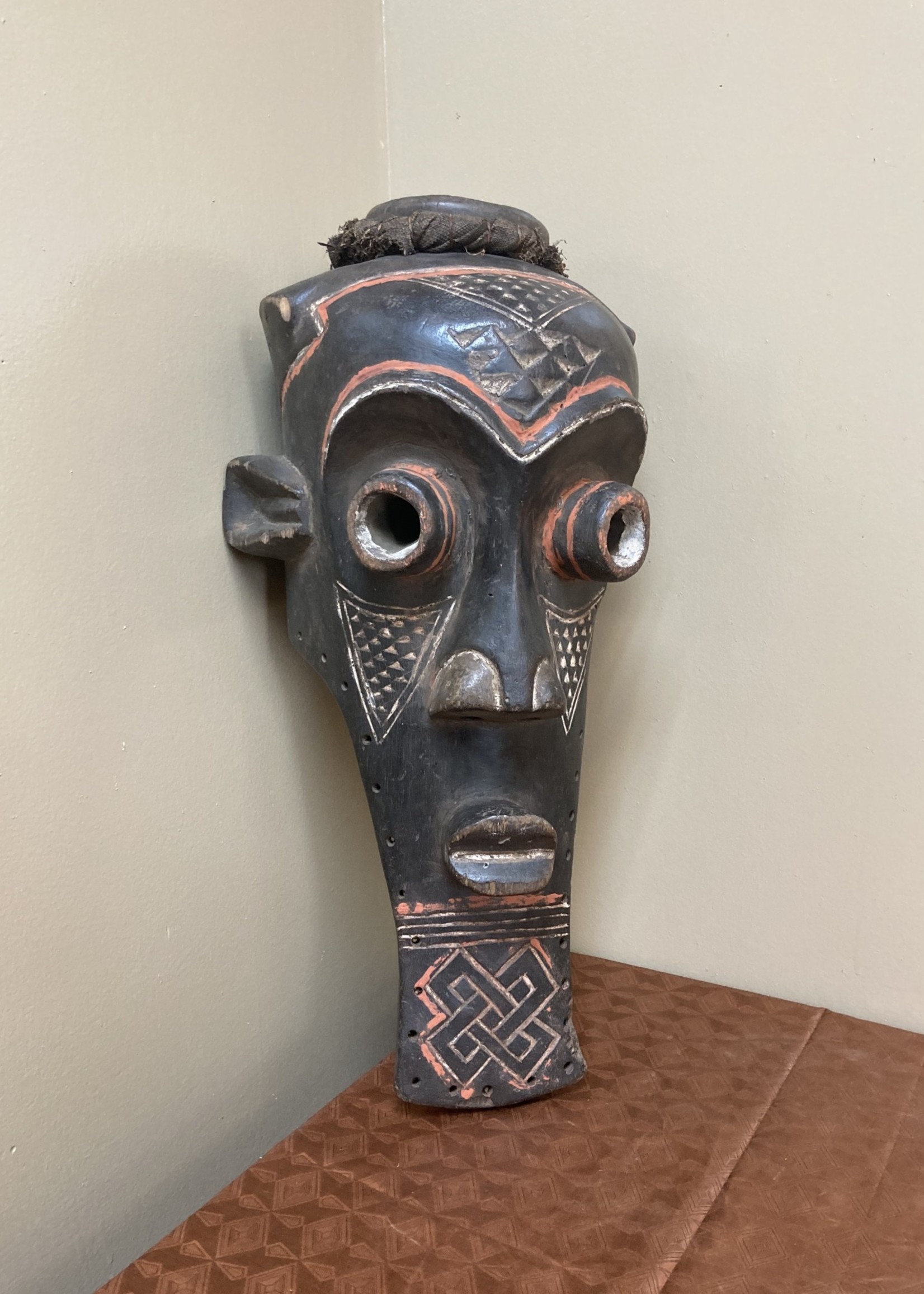 Kuba Kete of the Kuba confederation: initiation mask wooden with kaolin white and tukala red pigment. 20 1/4" tall x 9" wide (ear to ear). Dem Rep of Congo