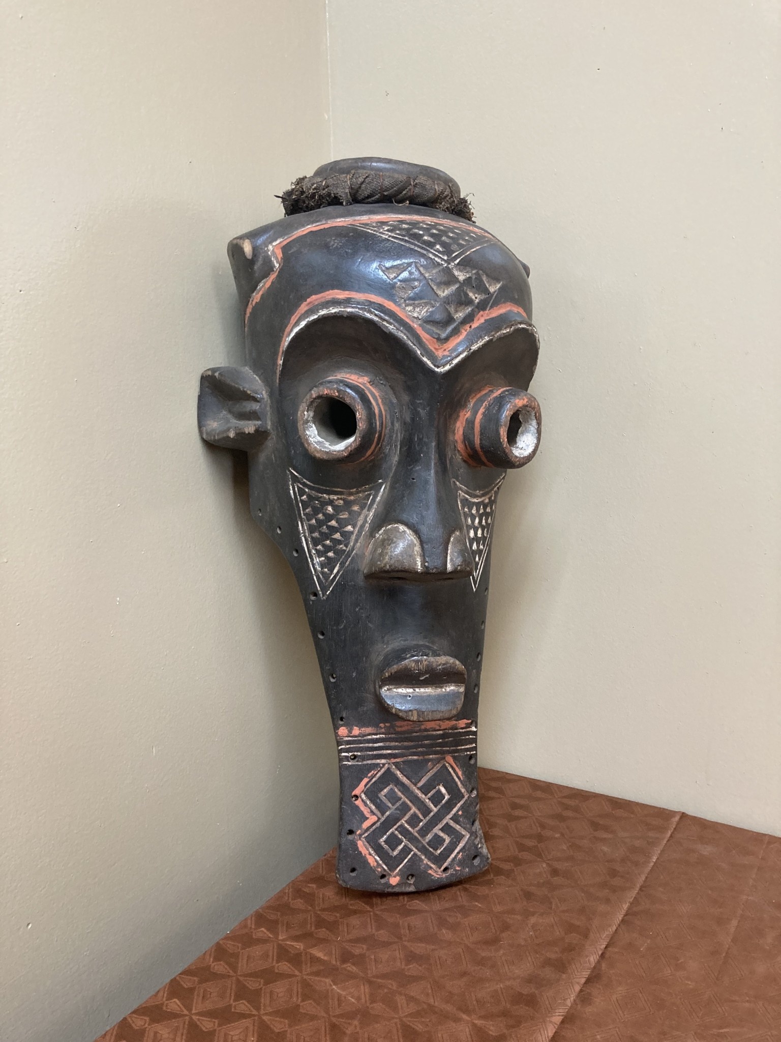 Kete of the Kuba confederation: initiation mask wooden with kaolin white and tukala red pigment. 20 1/4" tall x 9" wide (ear to ear). Dem Rep of Congo
