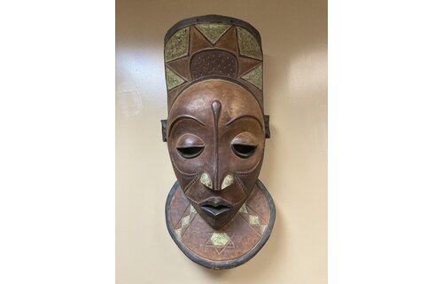 Pende X-Large Mask: The Bapende are found in Dem Rep of Congo. This mask is 35 ½” tall and 16 ½” wide. Masks this size often decorated a meeting house. Wooden