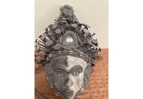 Kongo (Bakongo) wooden power figure or “Nkisi” Mask. It is decorated with cowrie shells, twine, iron nails, glass, and seeds. The Kongo ethnic group is found in Dem Rep of Congo. 16 ½ “ x 11 “