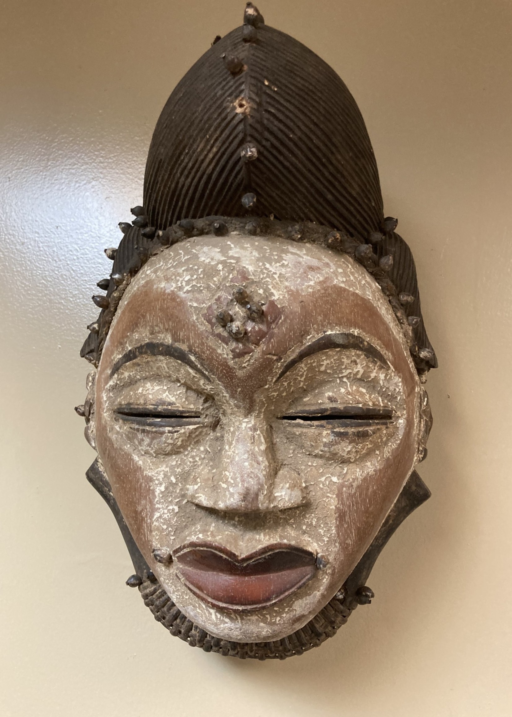 Punu Punu (Bapunu) mask that was probably used in invitations. 17” H x 9” W. The Bapunu live in Gabon.