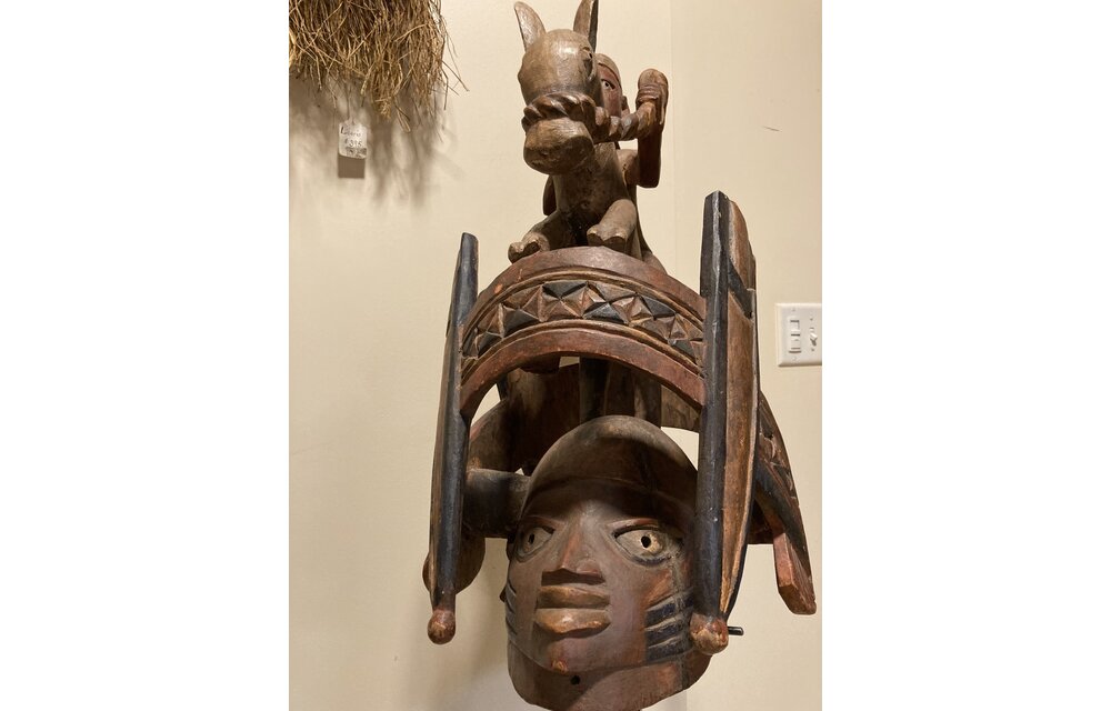 Yoruba "Gelede" mask. The Yoruba created this celebration in the 20th century. It celebrates older women, known to have much power, in a month-long event. Nigeria; wood 57 3/4" h on stand, 17 1/4" d x