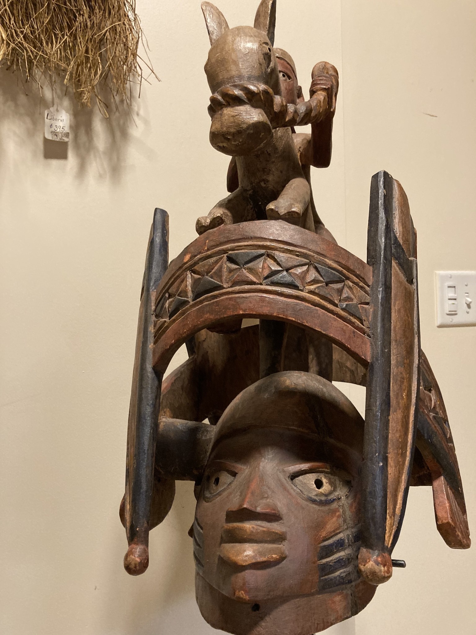 Yoruba "Gelede" mask. The Yoruba created this celebration in the 20th century. It celebrates older women, known to have much power, in a month-long event. Nigeria; wood 57 3/4" h on stand, 17 1/4" d x