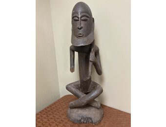 Dogon seated ancestor with a ”Thieves crook” over his shoulder. Height, 26 ⅞” from Mali.