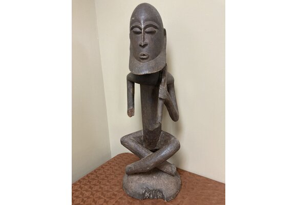 Dogon seated ancestor with a ”Thieves crook” over his shoulder. Height, 26 ⅞” from Mali.