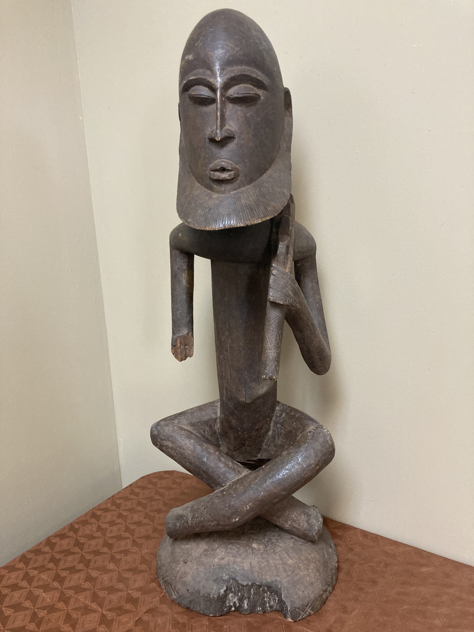 Dogon seated ancestor with a ”Thieves crook” over his shoulder. Height, 26 ⅞” from Mali.