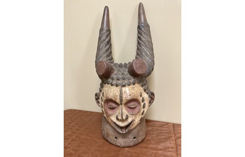 Ibo (igbo) headpiece/mask of wood, kaolin of red pigment that had use in the powerful men's secret society called mmo or mwo or mwa. It is 20 1/2" tall and 9/14" w. The Ibo live in the South east of N