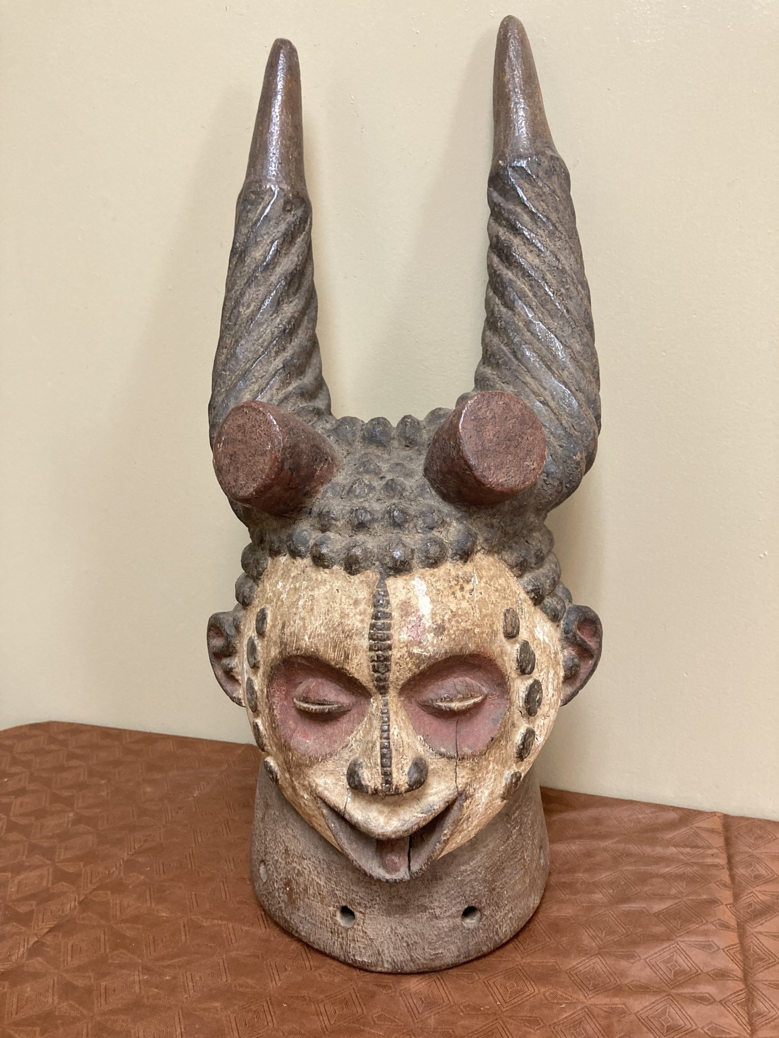 Ibo (igbo) headpiece/mask of wood, kaolin of red pigment that had use in the powerful men's secret society called mmo or mwo or mwa. It is 20 1/2" tall and 9/14" w. The Ibo live in the South east of N