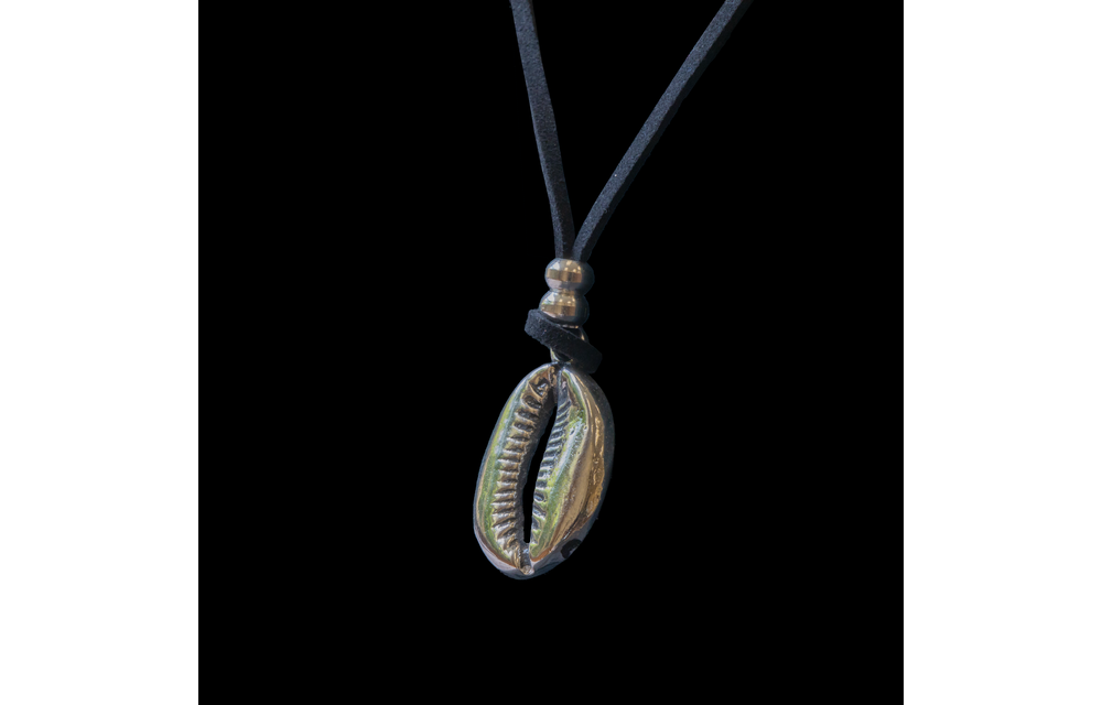 Silver cowrie pendant with leather cord.