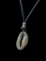 Silver cowrie pendant with leather cord.