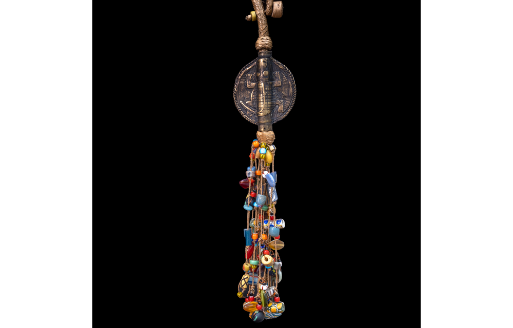 Extra long braided leather necklace adorned with brass and antique multi-colored wedding beads pendant.