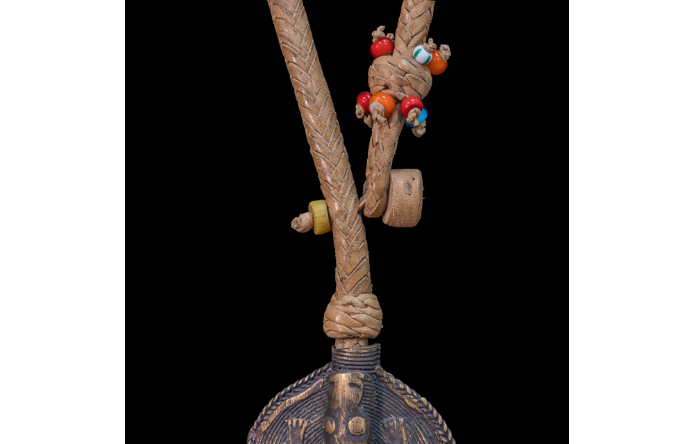 Extra long braided leather necklace adorned with brass and antique multi-colored wedding beads pendant.