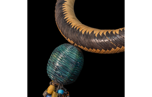 Braided leather necklace/choker adorned with antique multi-colored wedding beads.