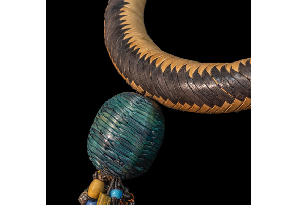 Braided leather necklace/choker adorned with antique multi-colored wedding beads.