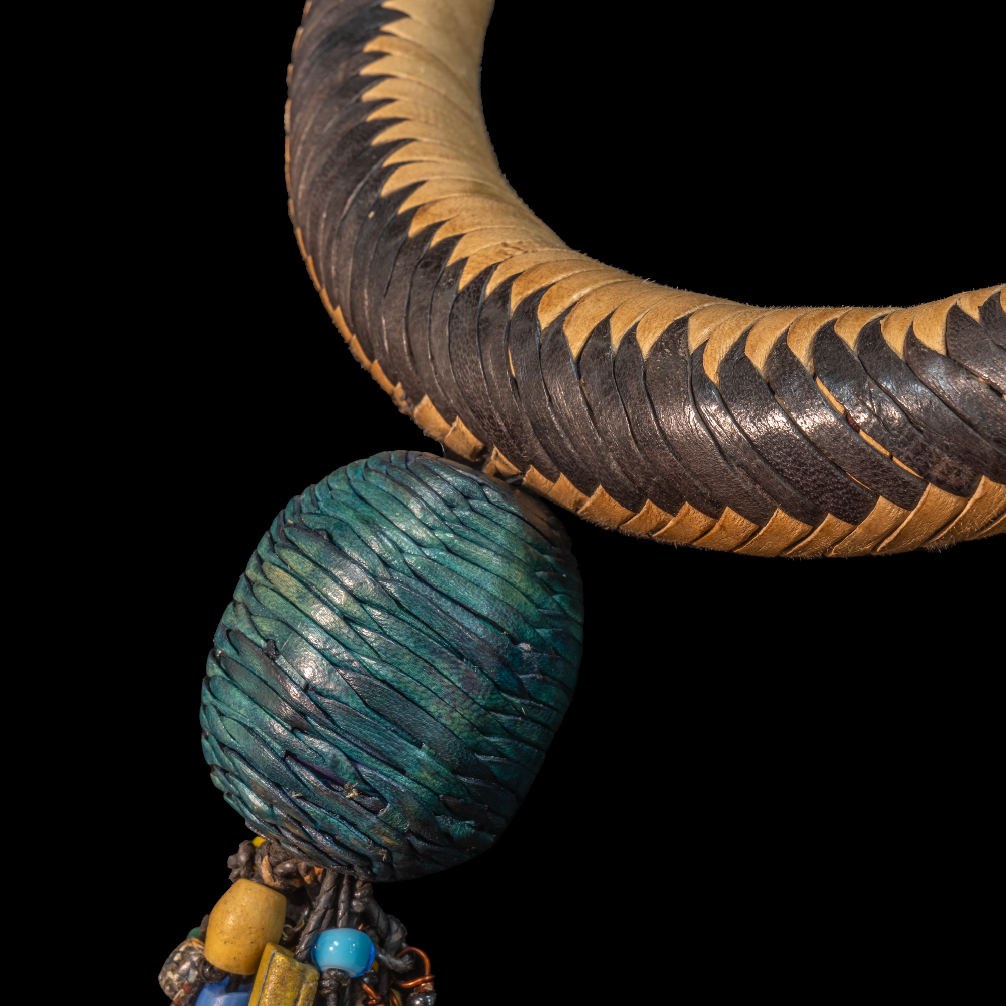 Braided leather necklace/choker adorned with antique multi-colored wedding beads.