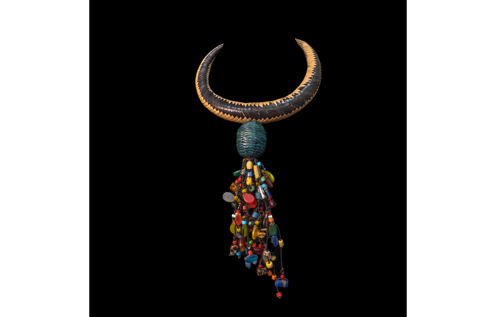 Braided leather necklace/choker adorned with antique multi-colored wedding beads.