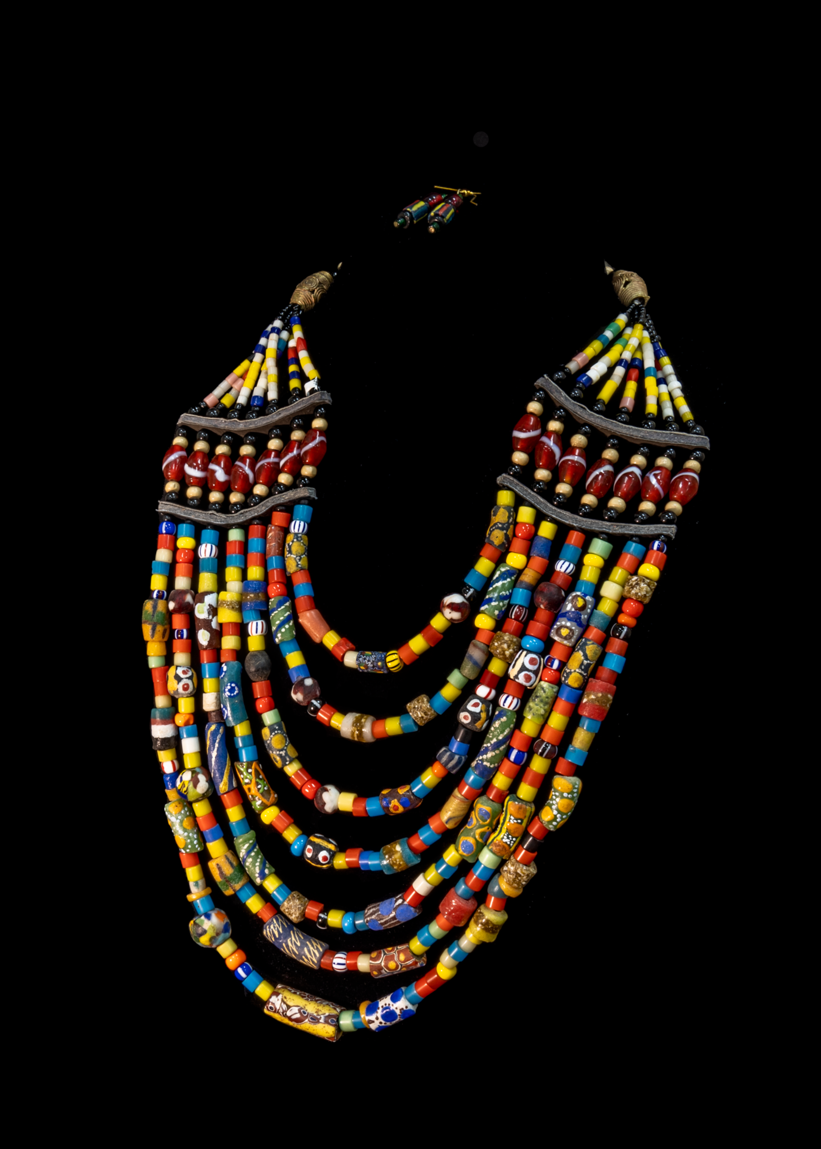 Mali Multi-colored and layered beaded necklace with brass pieces.