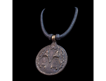 Braided leather necklace with antique bronze pendant.