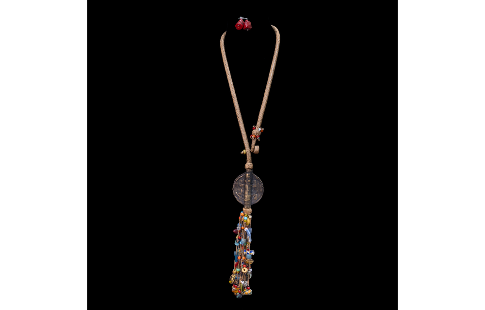 Extra long braided leather necklace adorned with brass and antique multi-colored wedding beads pendant.
