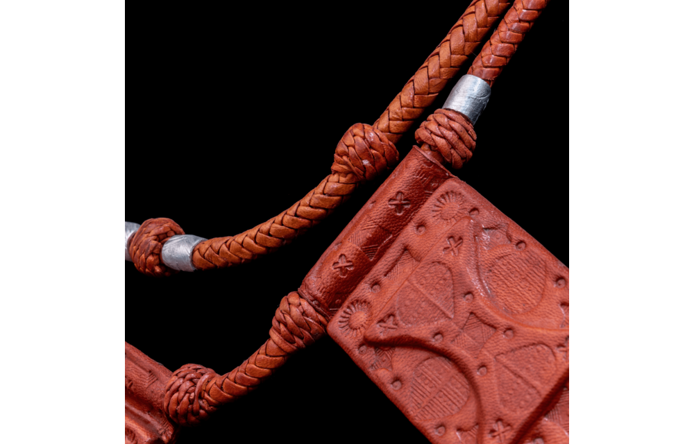 2-layered roped leather necklace with silver metal inserts.