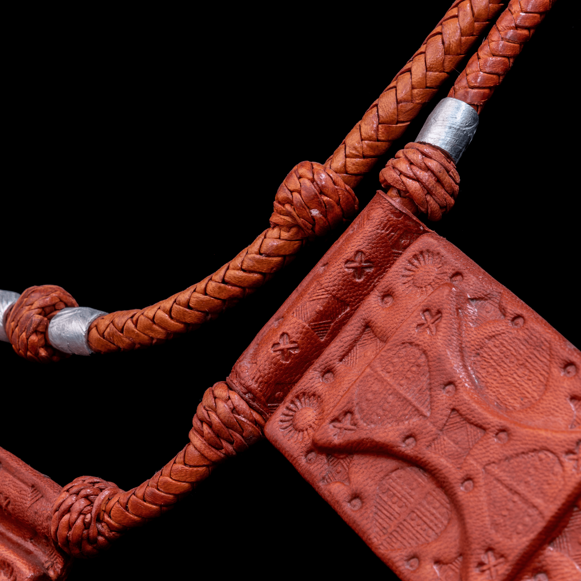 2-layered roped leather necklace with silver metal inserts.