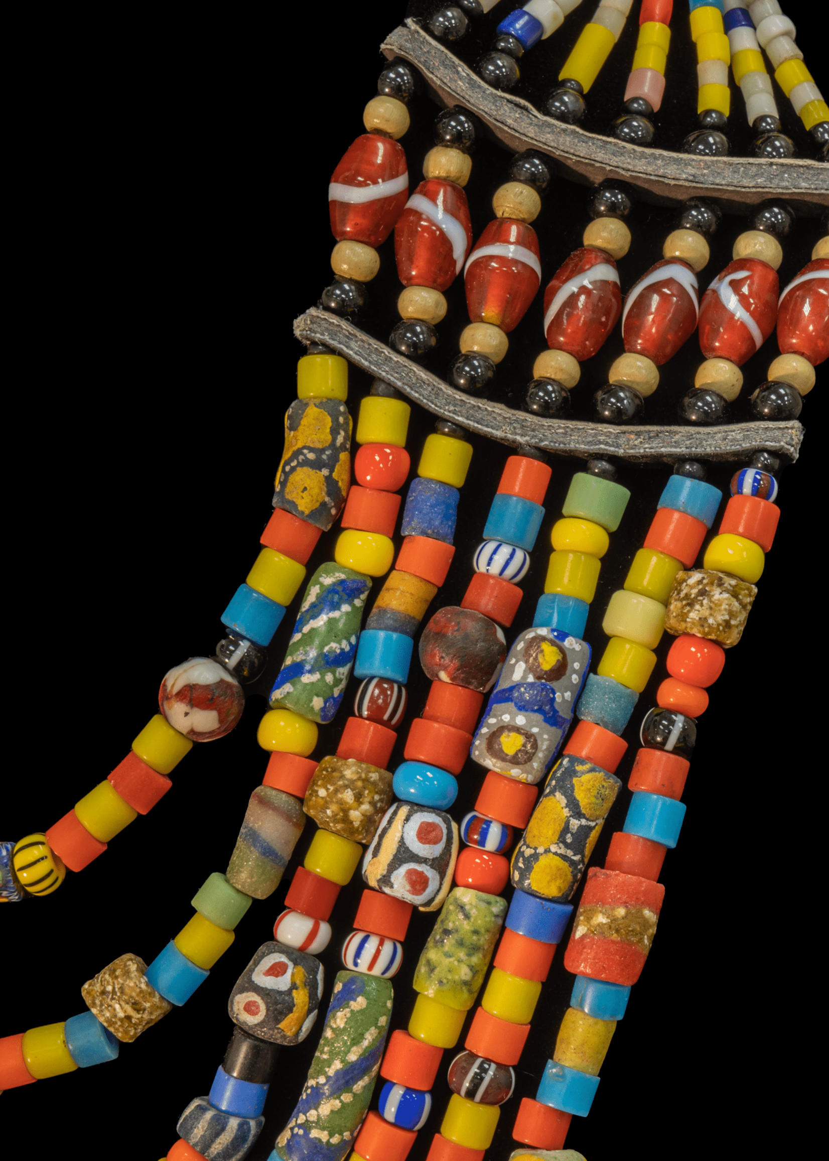 Mali Multi-colored and layered beaded necklace with brass pieces.