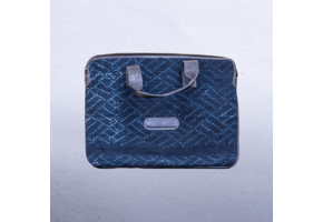 Cotton Indigo bag with leather trim and straps. Measures 14 x 9.5” Suitable for laptops.