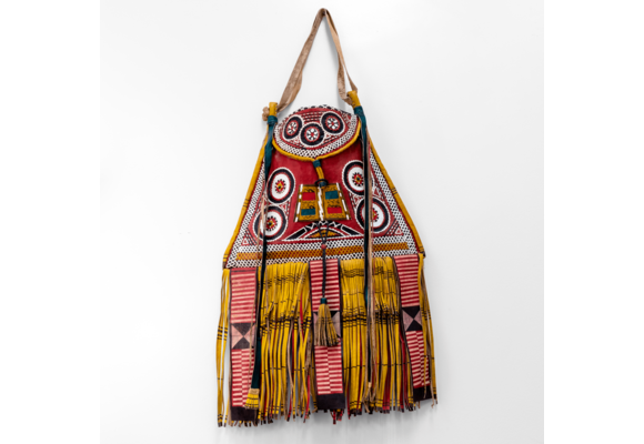 Modern take on traditional Tuareg camel leather bag. Ornate and colorful hand-made  leather bag with fringes.