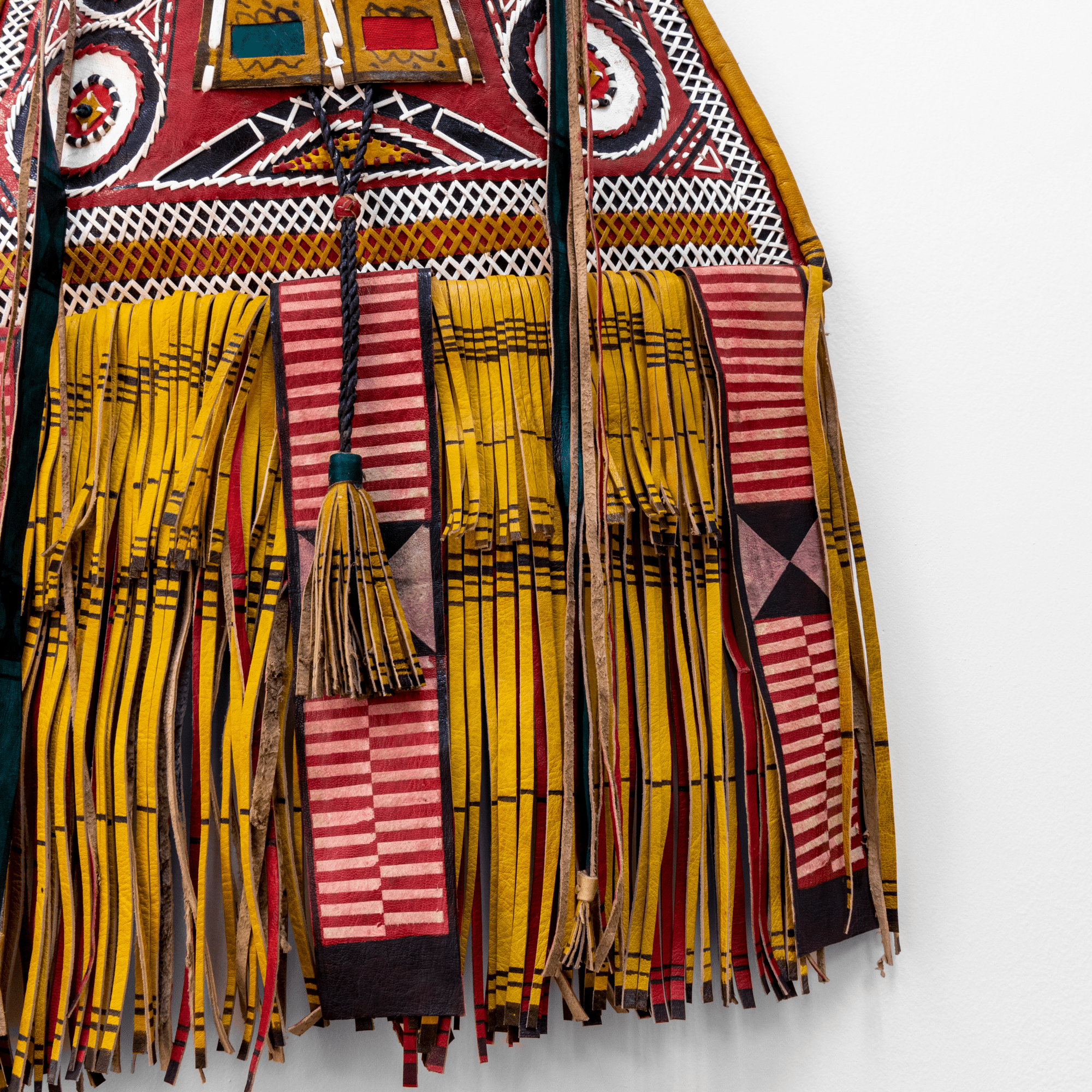 Modern take on traditional Tuareg camel leather bag. Ornate and colorful hand-made  leather bag with fringes.