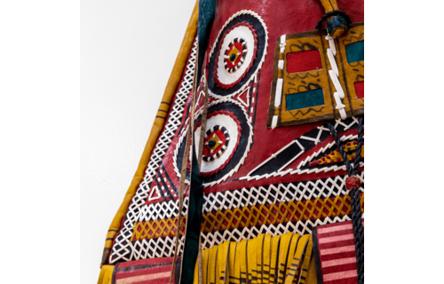 Modern take on traditional Tuareg camel leather bag. Ornate and colorful hand-made  leather bag with fringes.