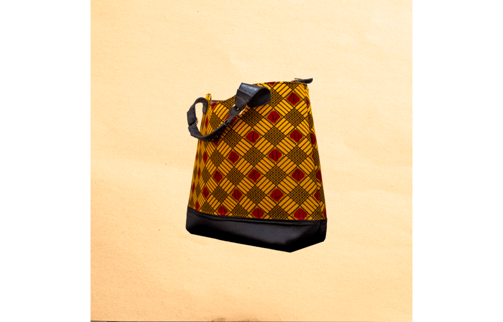 Large Ankara/canvas travel bag. Top zipper. Straps. Measures 21”x 10”