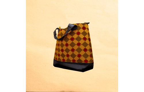 Large Ankara/canvas travel bag. Top zipper. Straps. Measures 21”x 10”