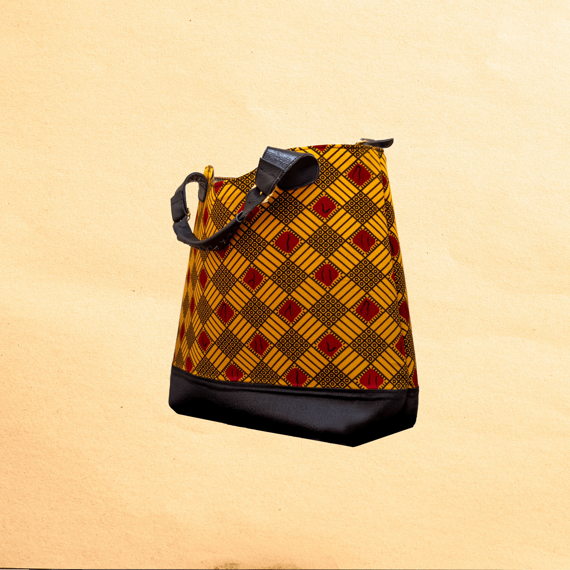 Large Ankara/canvas travel bag. Top zipper. Straps. Measures 21”x 10”