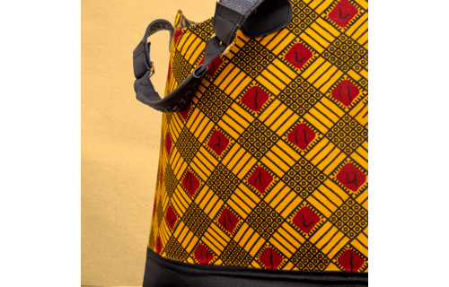 Large Ankara/canvas travel bag. Top zipper. Straps. Measures 21”x 10”