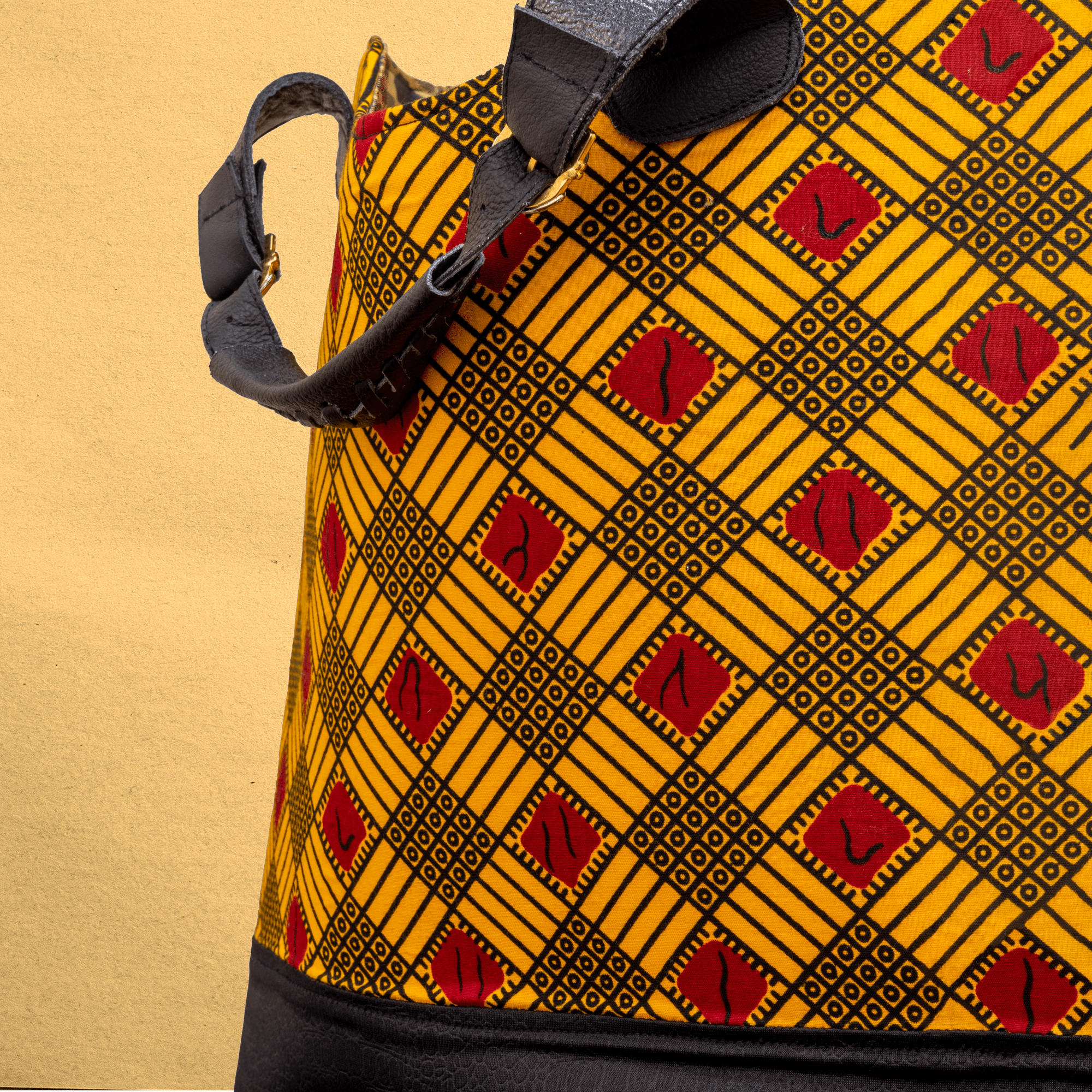 Large Ankara/canvas travel bag. Top zipper. Straps. Measures 21”x 10”