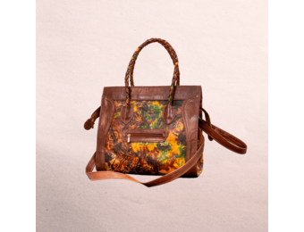 Leather body and trim. Short handles for carrying  and long shoulder straps. Inside and outside pockets! Top zipper. Measures 20.5” x 12.