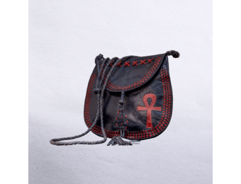 Beautiful cross-body leather bag. Has braided leather straps with Ankh adornment. Inside and outside pockets.