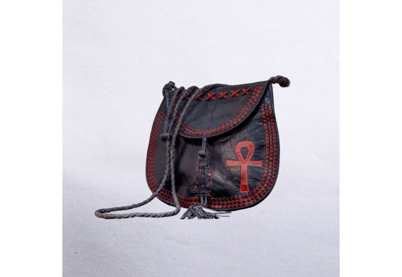 Beautiful cross-body leather bag. Has braided leather straps with Ankh adornment. Inside and outside pockets.