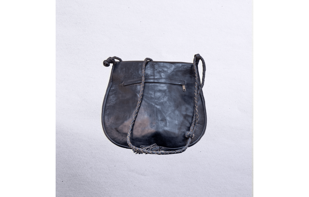 Beautiful cross-body leather bag. Has braided leather straps with Ankh adornment. Inside and outside pockets.