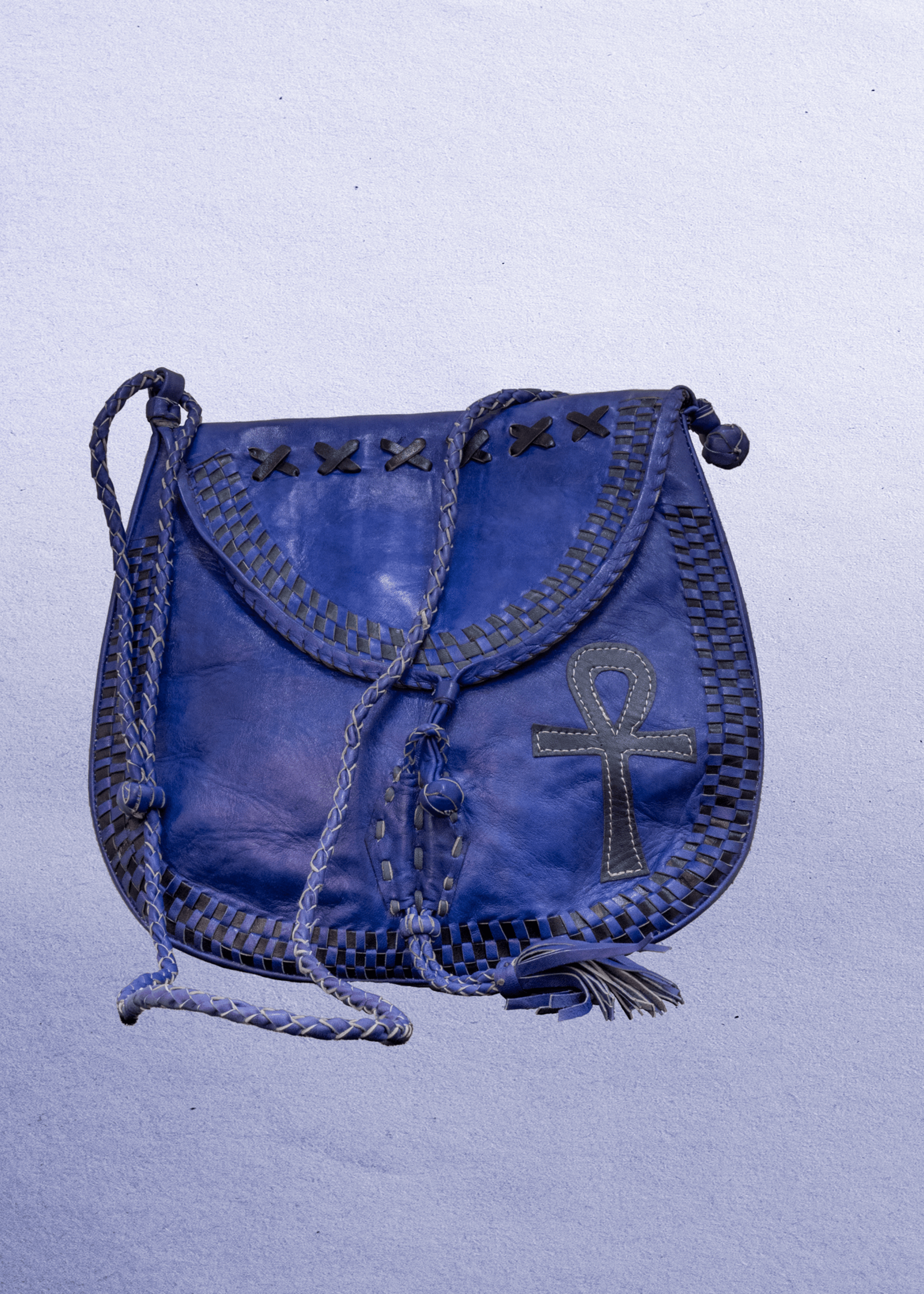 Mali Beautiful cross-body leather bag. Has braided leather straps with Ankh adornment. Inside and outside pockets.