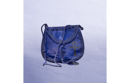 Beautiful cross-body leather bag. Has braided leather straps with Ankh adornment. Inside and outside pockets.