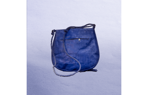 Beautiful cross-body leather bag. Has braided leather straps with Ankh adornment. Inside and outside pockets.