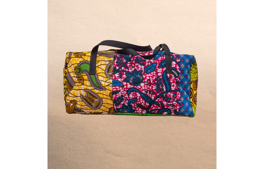 All Ankara overnight travel bag. All your stuff in one place! Top zipper. Measures 21” x 10”