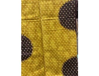 Spots Ankara Print. Sold by full yard only.