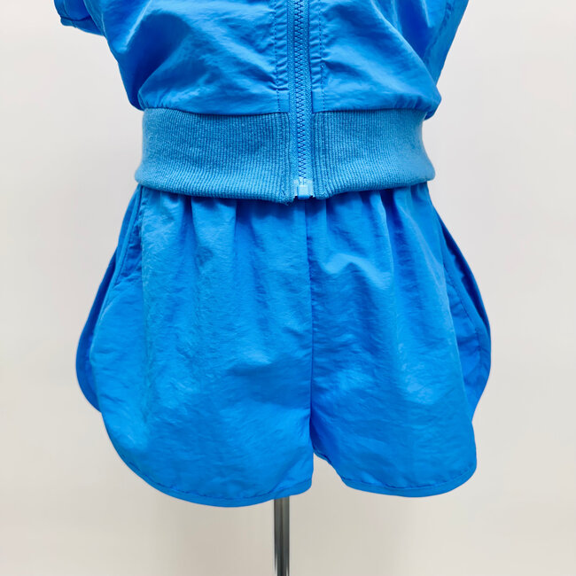 Sadie & Sage Back & Forth Curved Hem Nylon Shorts - Blue