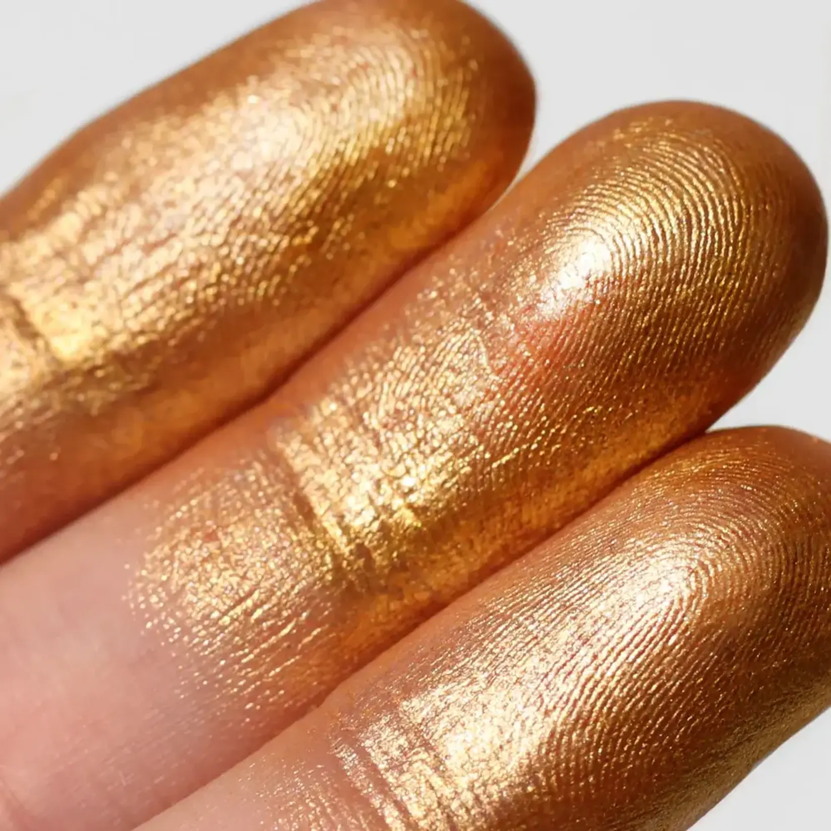 Moira Sombra en barra Moira Stellar glaze stick 03 Sun golden