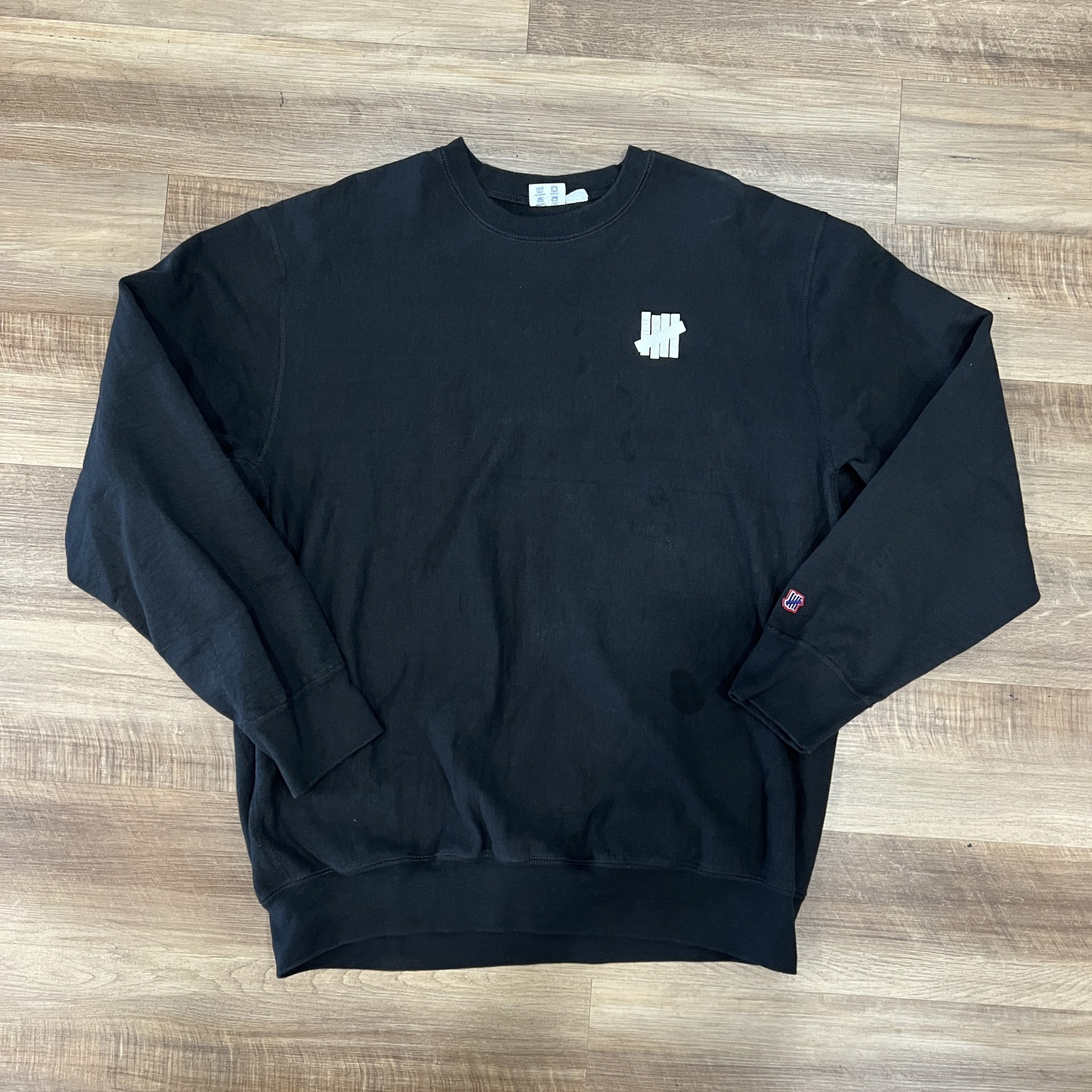 MENS UNDEFEATED CREWNECK BLACK Holy Ground Sneaker Shop Buy Sell Trade Sneakers