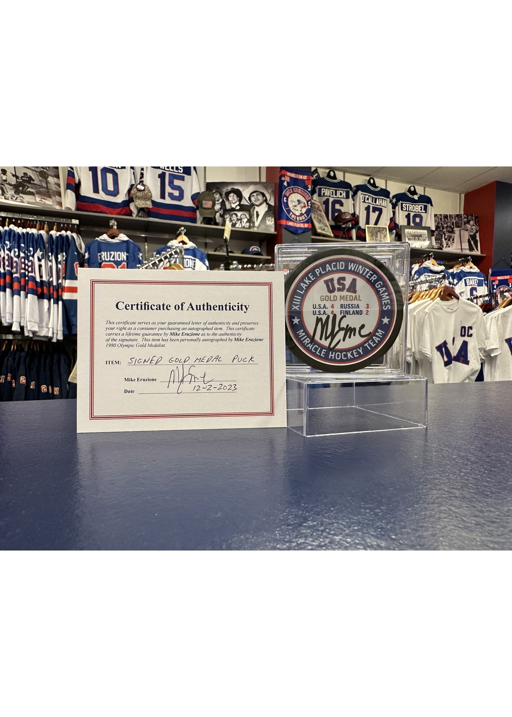 Eruzione Signed Gold Medal Puck