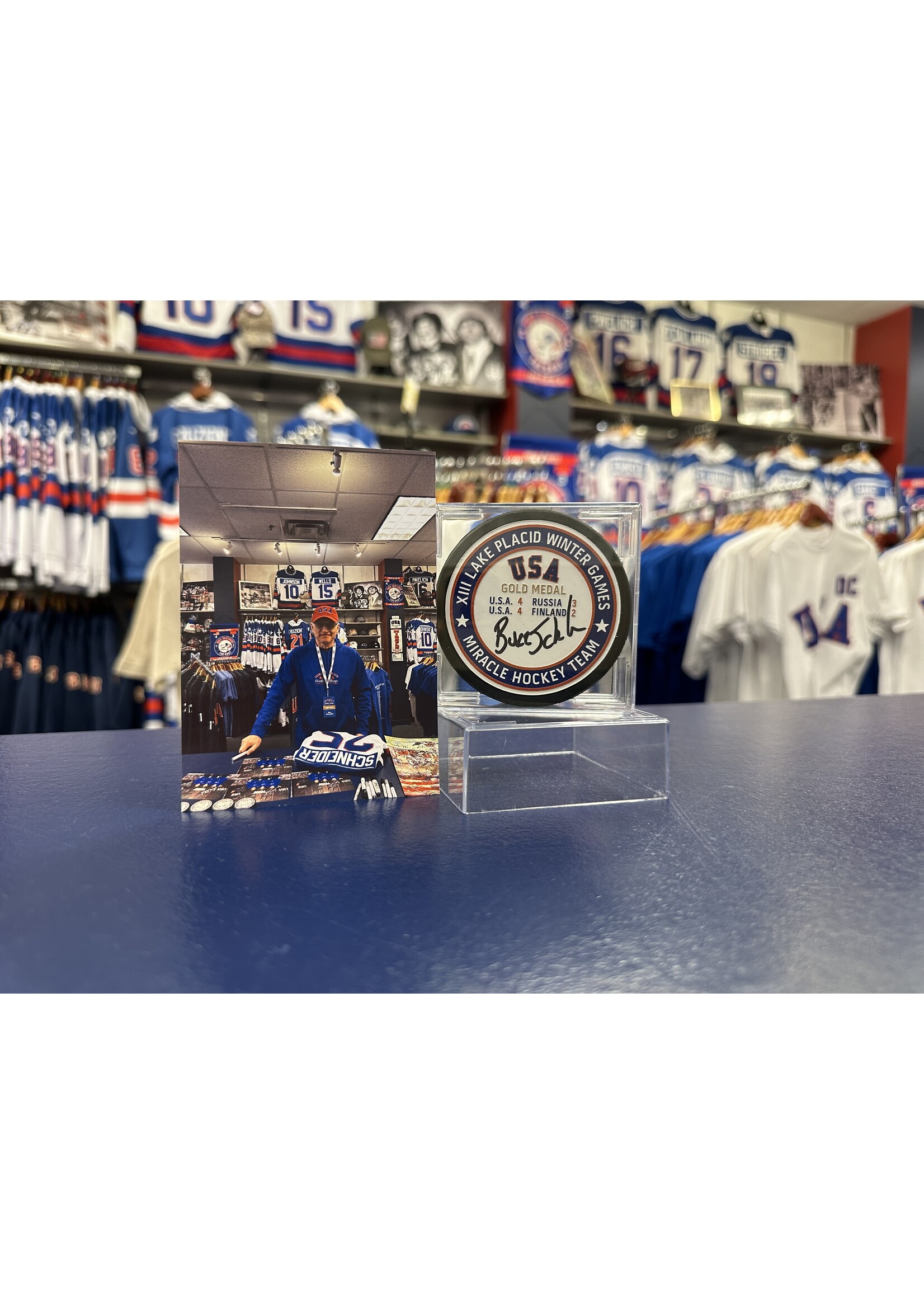Schneider Signed Gold Medal Puck